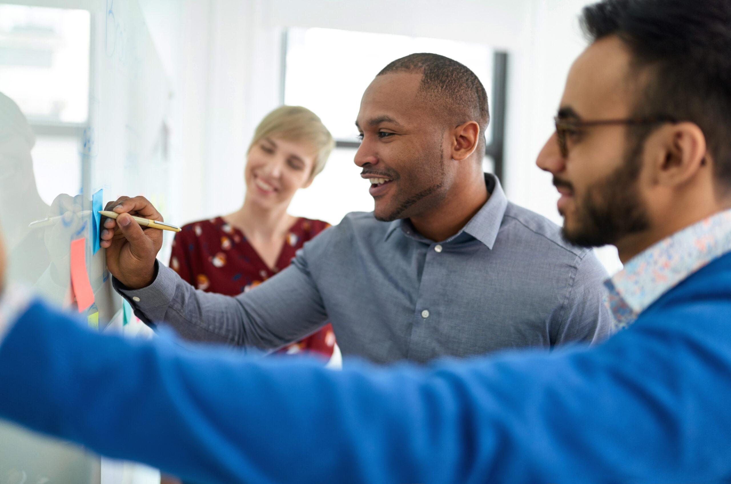 Diverse team of creative coworkers brainstorming strategies